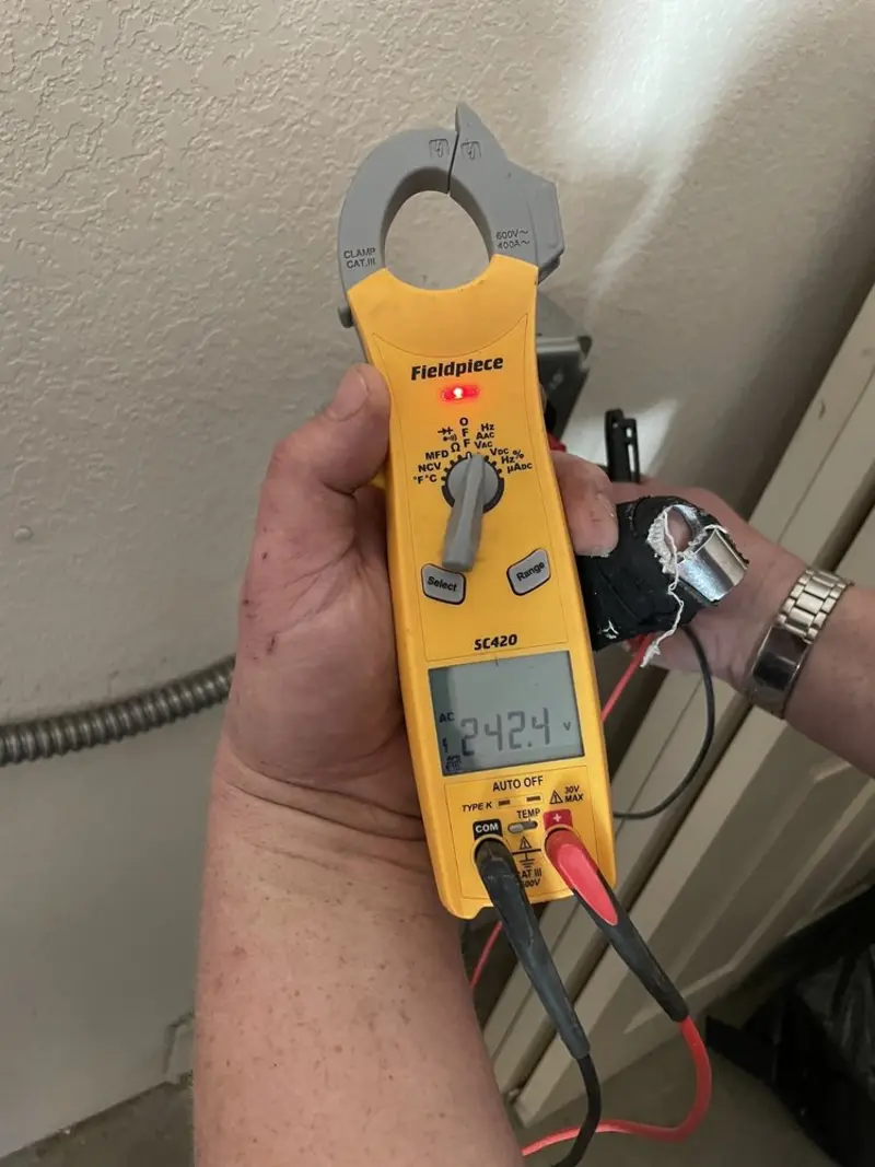 Voltage testing with clamp meter during Outlet Installation in Martinez